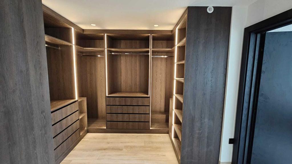 Walk In Wardrobe with feature lighting